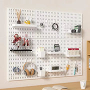 White wall pegboard storage setup