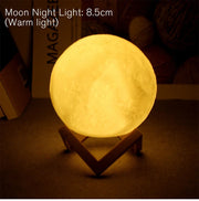 Warm glow moon lamp on wooden stand